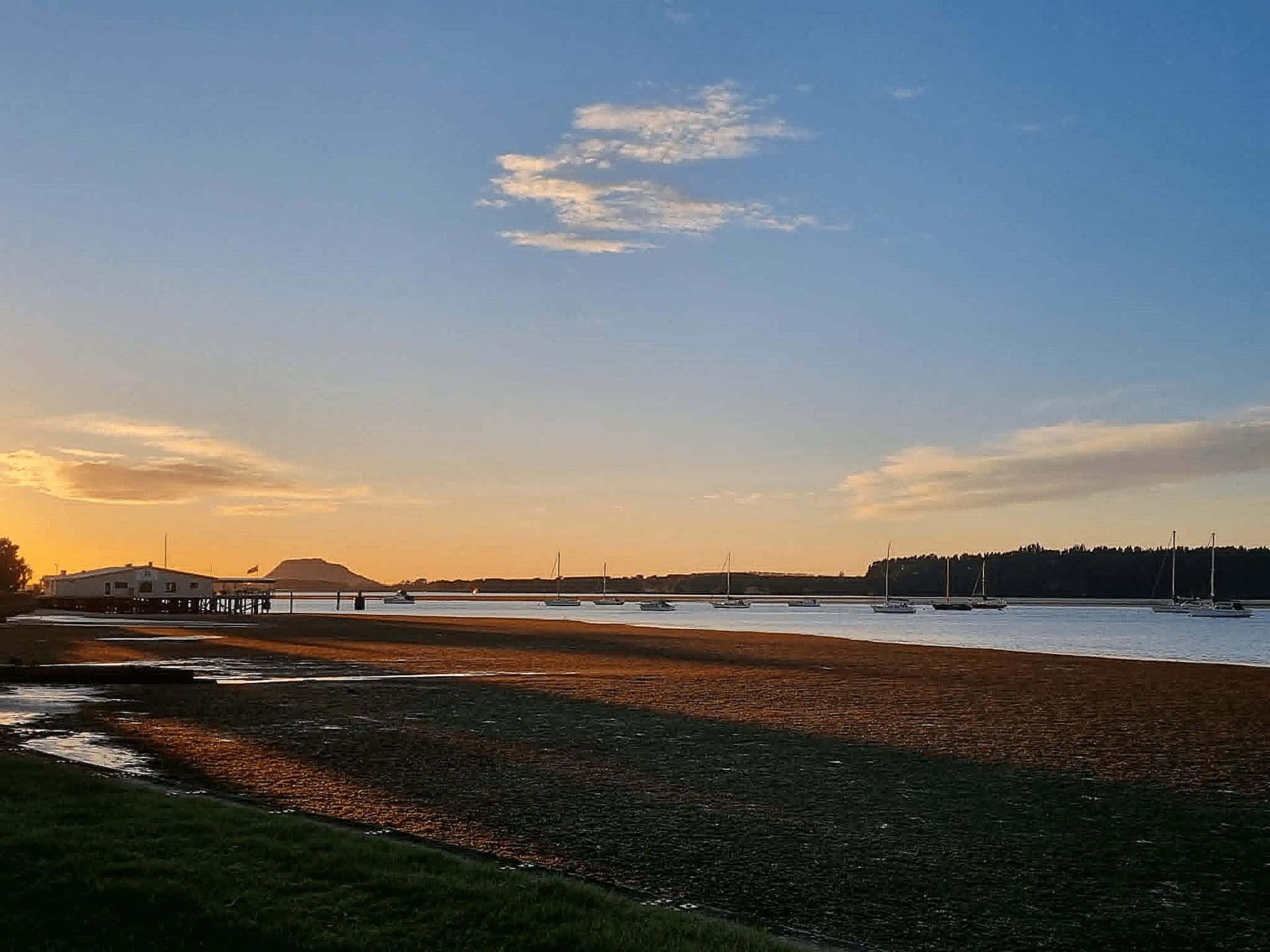 Tauranga harbour at sunset with Mauao in the distance