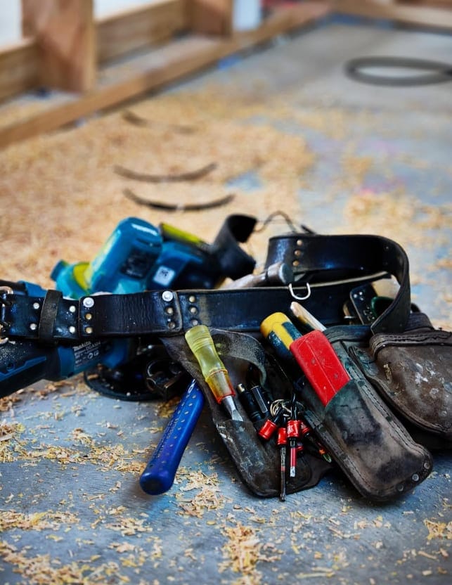 Builder's tool belt on site